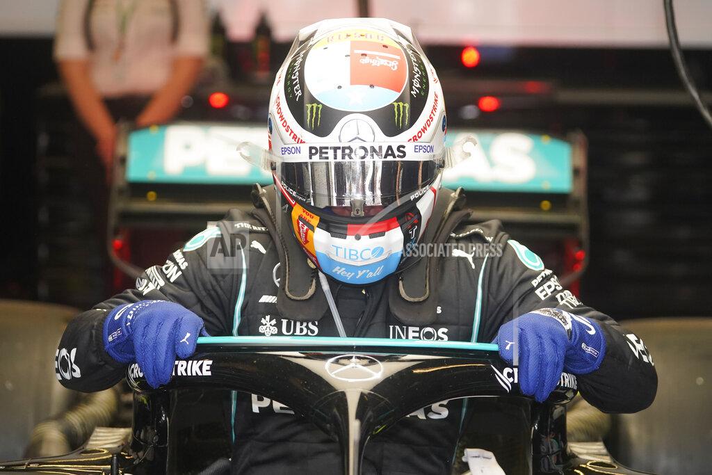 Darron Cummings Mercedes driver Valtteri Bottas, of Finland, climbs out of his car following a practice session for the F1 US Grand Prix auto race at the Circuit of the Americas, Friday, Oct. 22, 2021, in Austin, Texas. (AP Photo/Darron Cummings)