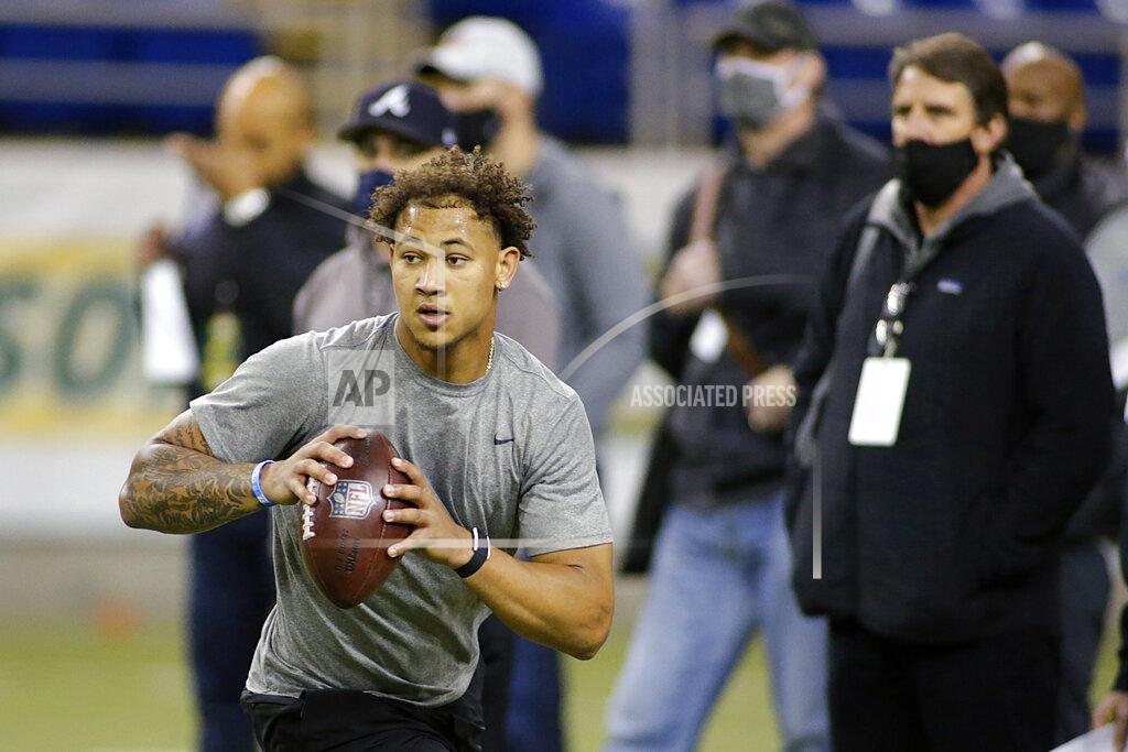 Andy Clayton-King North Dakota State quarterback Trey Lance rolls out at the school's football NFL Pro Day Friday, March, 12, 2021, in Fargo, North Dakota. (AP Photo/Andy Clayton- King)
