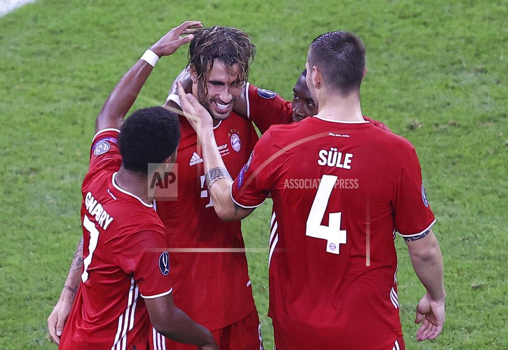 Laszlo Szirtesi Bayern's players celebrate after Javi Martinez scored his side's second goal during the UEFA Super Cup soccer match between Bayern Munich and Sevilla at the Puskas Arena in Budapest, Hungary, Thursday, Sept. 24, 2020. (Laszlo Szirtesi/Pool via AP)