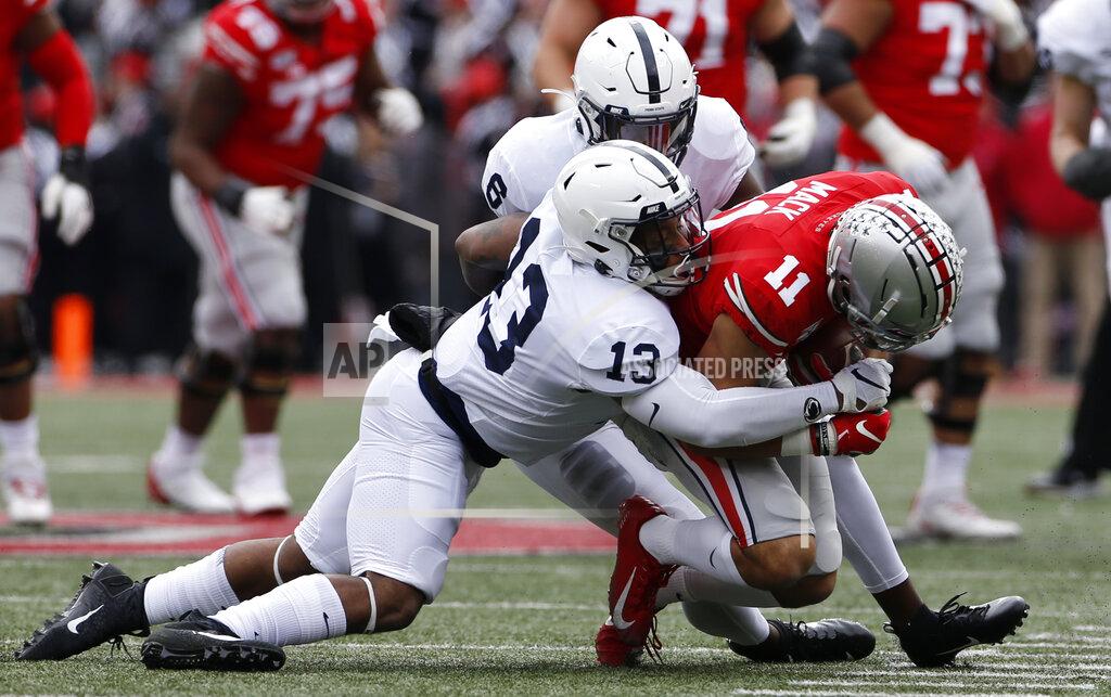 Jay Laprete Ohio State receiver Austin Mack, right, is tackled by Penn State linebackers Cam Brown, top, and Ellis Brooks during the first half of an NCAA college football game Saturday, Nov. 23, 2019, in Columbus, Ohio. A little more than a week before the NFL draft, rookie New York Giants coach Joe Judge said versatility was something he wanted from his players, especially the new ones. Brown, a sixth-round choice, and Carter Coughlin of Minnesota, the first of four seventh-round choices, have already shown multiple abilities on the field. (AP Photo/Jay LaPrete, File)