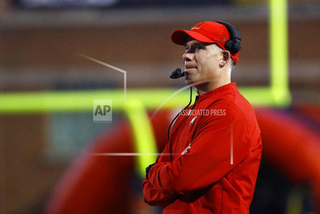 FILE - In this Nov. 25, 2017, file photo, Maryland head coach DJ Durkin watches the first half of an NCAA college football game against Penn State in College Park, Md. An external investigation of the Maryland football program under coach Durkin has determined that the team "did not have a toxic culture," but was problematic enough to where players feared speaking out. (AP Photo/Patrick Semansky, File)