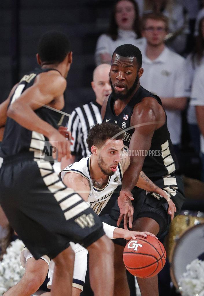John Bazemore Georgia Tech guard Jose Alvarado (10) drives between Wake Forest forward Ikenna Smart (35), right and guard Torry Johnson (4) during the first half of an NCAA college basketball game, Saturday, Jan. 5, 2019, in Atlanta. (AP Photo/John Bazemore)