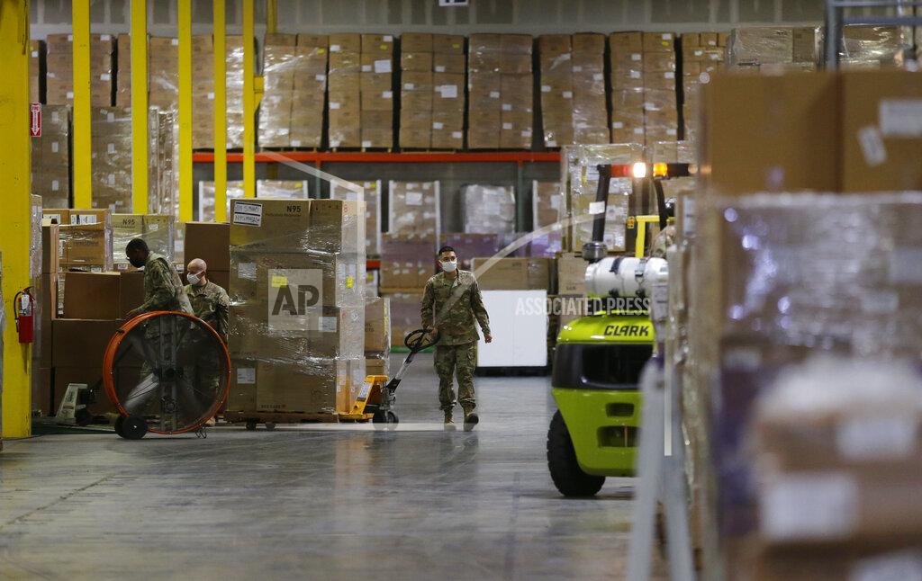 Eric Gay Members of the National Guard work with Personal Protective Equipment during the coronavirus pandemic at a Texas Division of Emergency Management Warehouse, Tuesday, Aug. 4, 2020, in San Antonio. (AP Photo/Eric Gay)