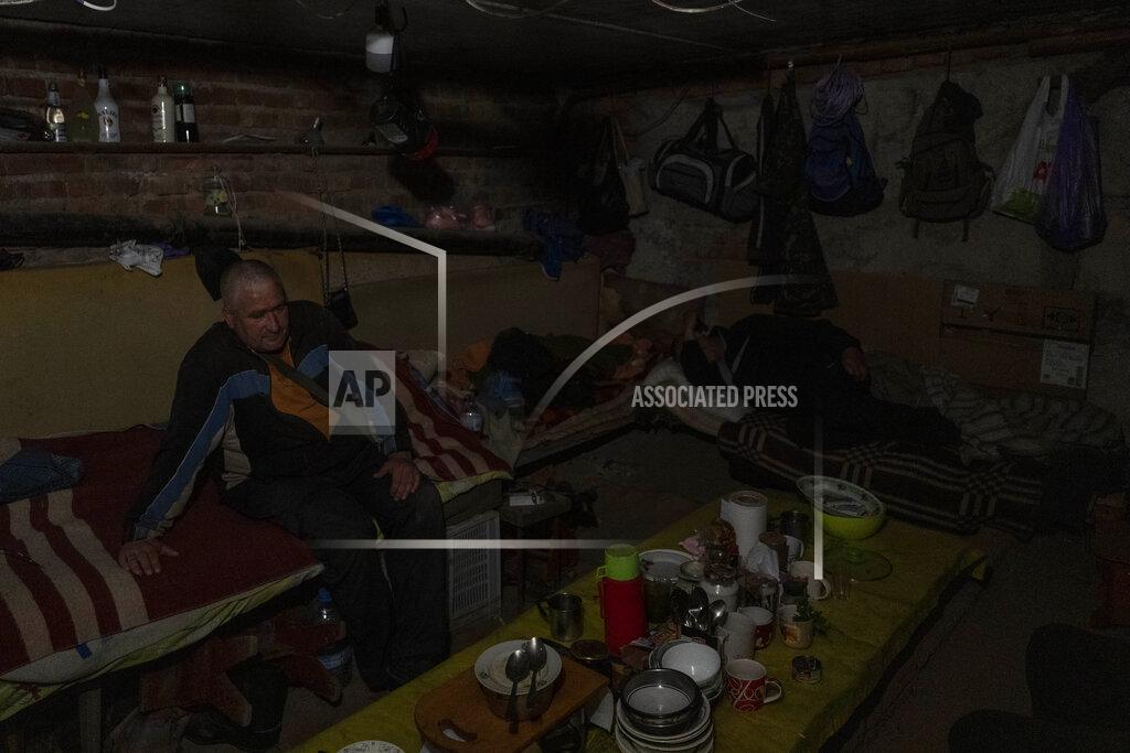 Bernat Armangue Residents live in the basement of a building used as bomb shelter in the village of Staryi Saltiv, east Kharkiv, Ukraine, Friday, May 20, 2022. The village formerly occupied by Russian forces is back under Ukrainian control, albeit very close to the front line and under constant shelling. (AP Photo/Bernat Armangue)
