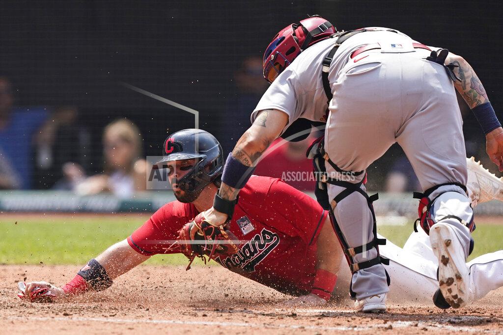 Tony Dejak Cleveland Indians' Austin Hedges scores as St. Louis Cardinals' Yadier Molina is late on the tag in the fourth inning of a baseball game, Wednesday, July 28, 2021, in Cleveland. (AP Photo/Tony Dejak)
