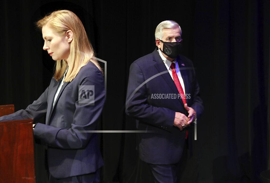 Robert Cohen FILE - In this Oct. 9, 2020, file photo, Missouri gubernatorial candidates, Gov. Mike Parson, and State Auditor Nicole Galloway are seen onstage before the Missouri gubernatorial debate at the Missouri Theatre in Columbia, Missouri. They are opposing each other in the Nov. 3, 2020, general election. (Robert Cohen/St. Louis Post-Dispatch via AP, Pool, File)