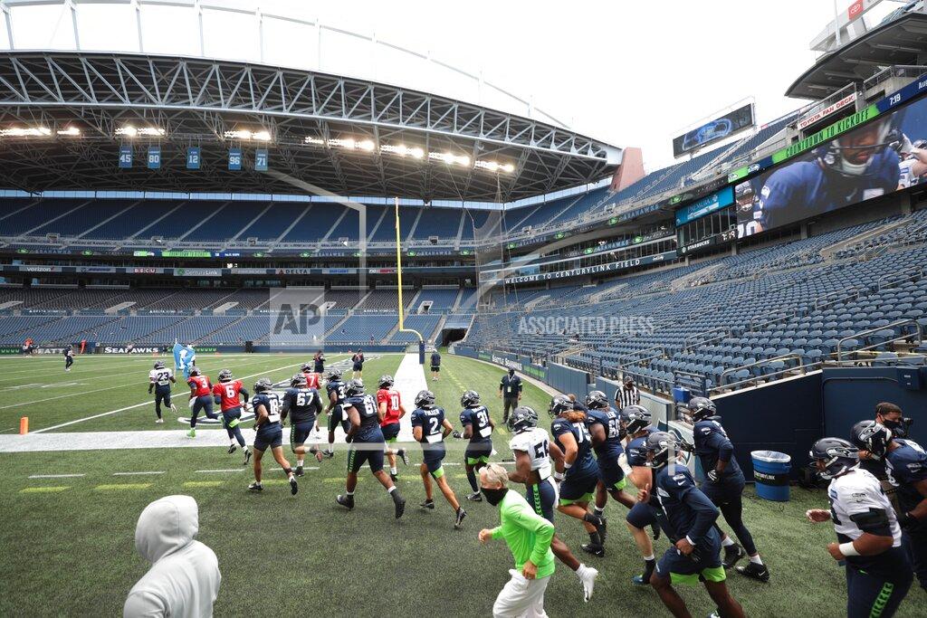 Bettina Hansen FILE - The Seattle Seahawks take to an empty CenturyLink Field for the NFL football team's scrimmage Saturday, Aug. 22, 2020, in Seattle. One of the best home field advantages in the NFL will sit empty on Sunday night, Sept. 20. The Seahawks know it will be strange having no fans inside CenturyLink Field. But being an opponent in Seattle has gained such a reputation even some Patriots are disappointed there won't be fans. (Bettina Hansen/The Seattle Times via AP, File)