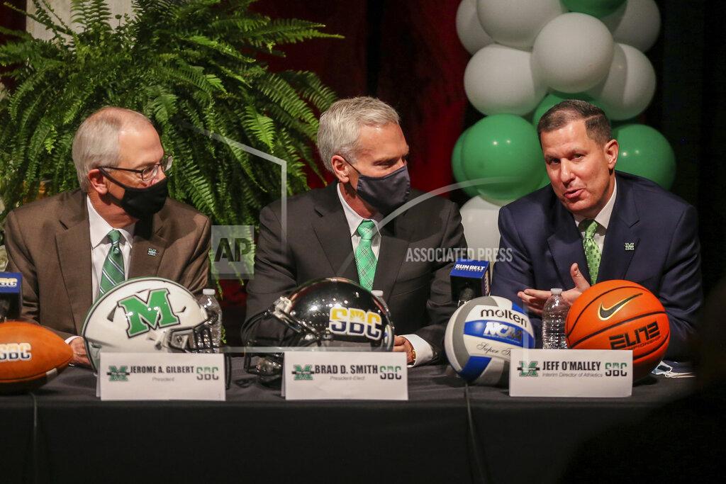 Ryan Fischer Marshall University interim director of athletics Jeff O'Malley, right, answers questions during a press conference about joining the Sun Belt Conference as Marshall president Dr. Jerome A. Gilbert, left, and president-elect Brad D. Smith look on, Monday, Nov. 1, 2021, in Huntington, W.Va. (Ryan Fischer/The Herald-Dispatch via AP)