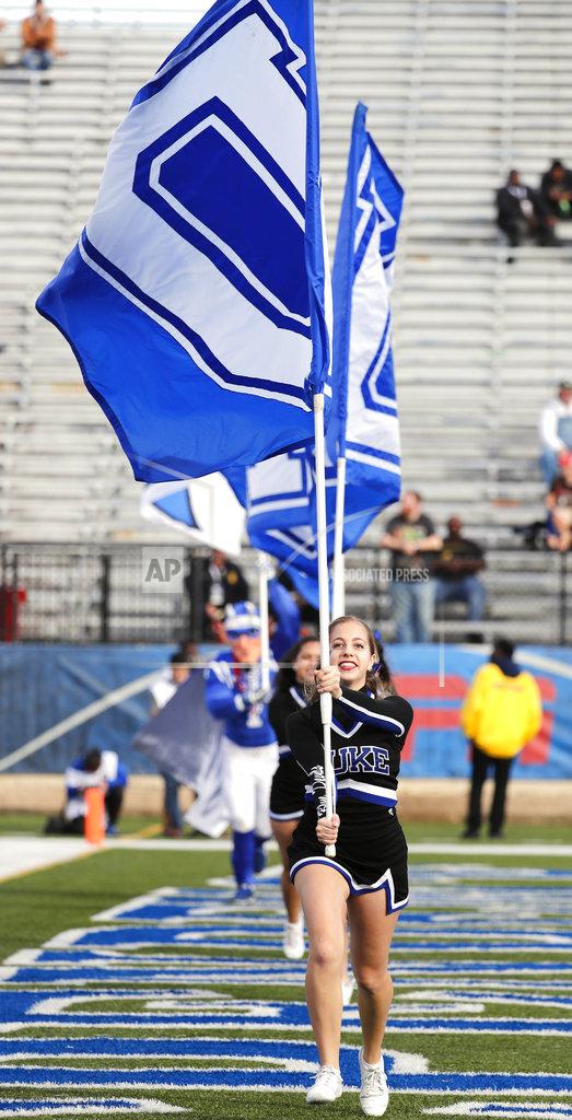 Rogelio V. Solis Duke cheerleaders run with their school banner following a score against Temple in the second half of the Independence Bowl NCAA college football game in Shreveport, La., Thursday, Dec. 27, 2018.(AP Photo/Rogelio V. Solis)