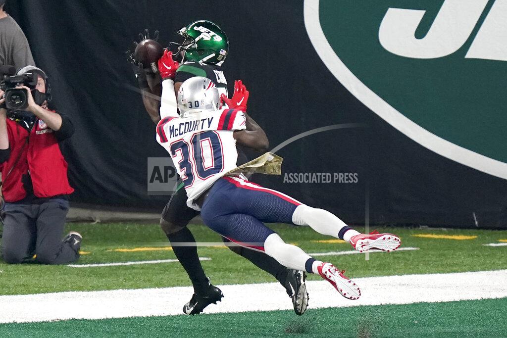 Corey Sipkin New York Jets' Jamison Crowder, top, catches a touchdown in front of New England Patriots' Jason McCourty during the first half of an NFL football game, Monday, Nov. 9, 2020, in East Rutherford, N.J. (AP Photo/Corey Sipkin)