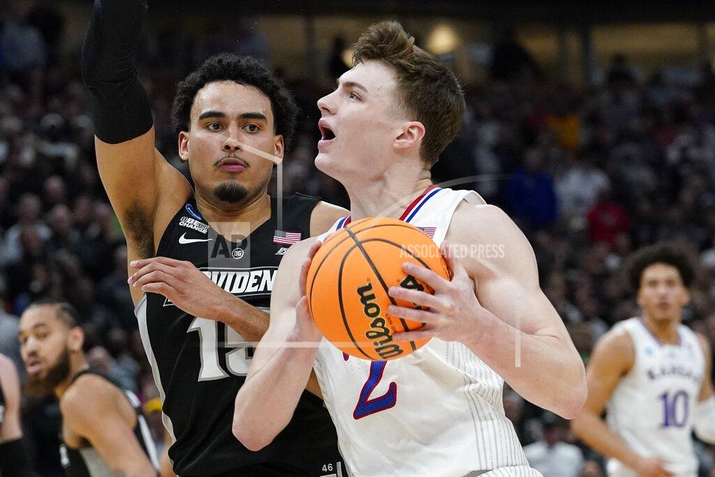 Nam Y. Huh Kansas' Christian Braun tries to drive past Providence's Justin Minaya during the second half of a college basketball game in the Sweet 16 round of the NCAA tournament Friday, March 25, 2022, in Chicago. (AP Photo/Nam Y. Huh)
