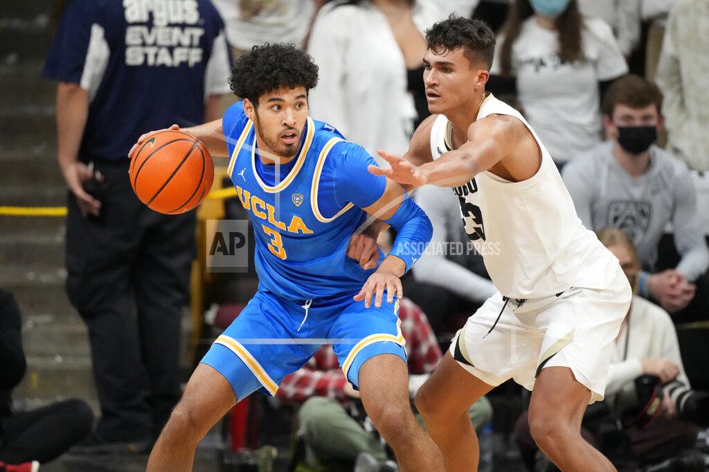 David Zalubowski UCLA guard Johnny Juzang, left, is defended by Colorado forward Tristan da Silva during the second half of an NCAA college basketball game Saturday, Jan. 22, 2022, in Boulder, Colo. UCLA won 71-65. (AP Photo/David Zalubowski)
