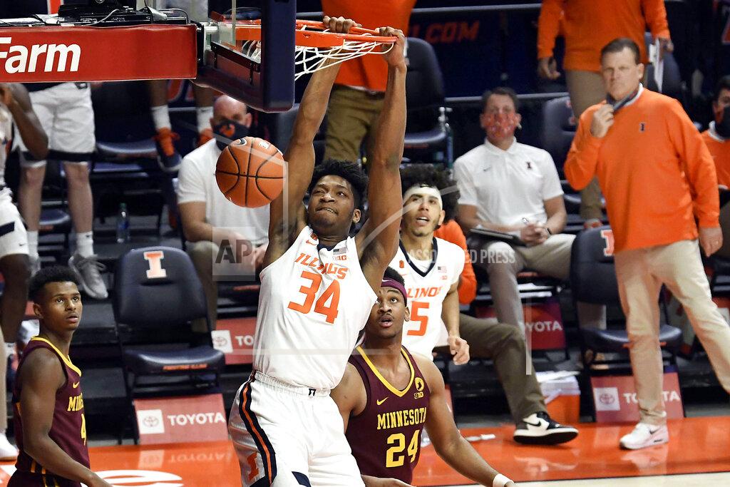 Holly Hart Illinois center Jermaine Hamlin (34) dunks the ball against Minnesota in the second half of an NCAA college basketball game Tuesday, Dec. 15, 2020, in Champaign, Ill. (AP Photo/Holly Hart)