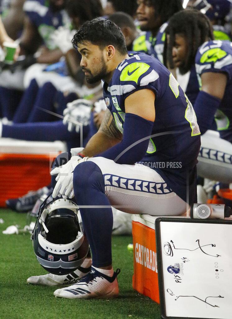 Seattle Seahawks safety Shalom Luani (24) sits on the bench late during the second half of the NFC wild-card NFL football game against the Dallas Cowboys in Arlington, Texas, Saturday, Jan. 5, 2019. The Dallas Cowboys won 24-22. (AP Photo/Michael Ainsworth)