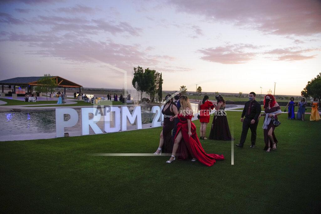 Paul Ratje Young people attend prom at the Grace Gardens Event Center in El Paso, Texas on Friday, May 7, 2021. Around 2,000 attended the outdoor event at the private venue after local school districts announced they would not host proms this year. Tickets cost $45. (AP Photo/Paul Ratje)
