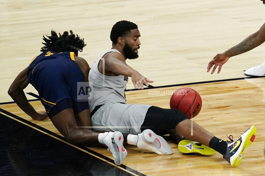 John Locher California's Joel Brown, left, and Colorado's Jeriah Horne fall to the court during the second half of an NCAA college basketball game in the quarterfinal round of the Pac-12 men's tournament Thursday, March 11, 2021, in Las Vegas. (AP Photo/John Locher)
