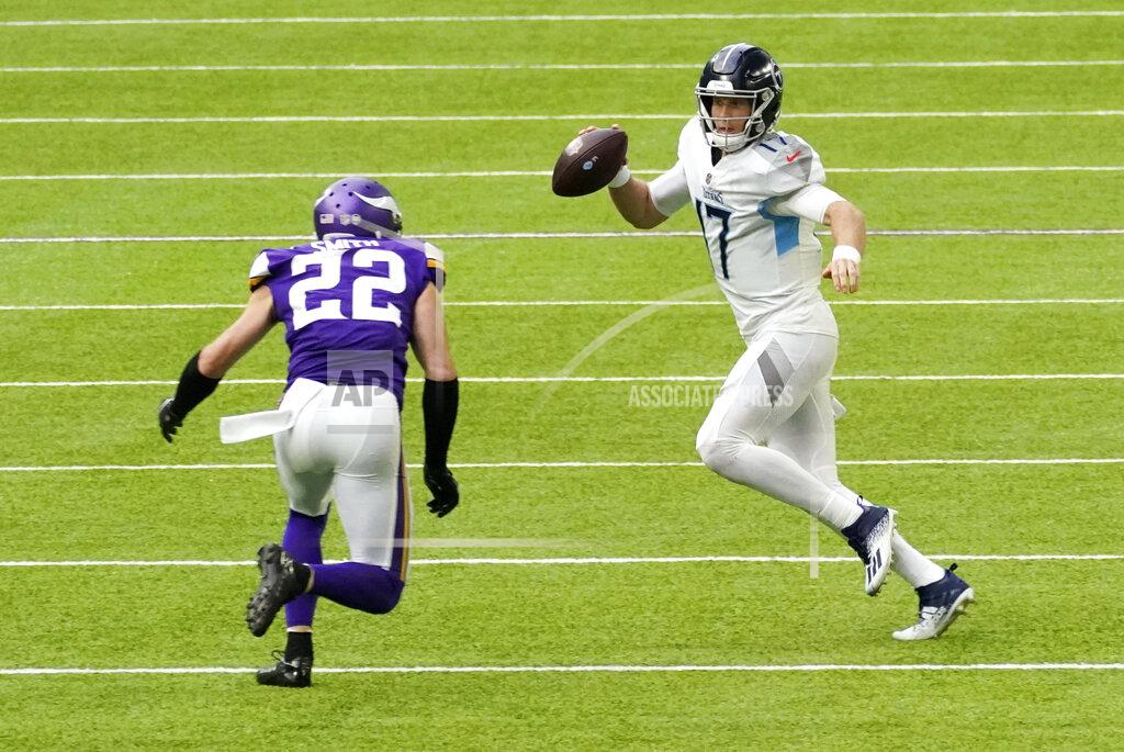 Jim Mone Tennessee Titans quarterback Ryan Tannehill (17) runs from Minnesota Vikings strong safety Harrison Smith (22) during the second half of an NFL football game, Sunday, Sept. 27, 2020, in Minneapolis. (AP Photo/Jim Mone)