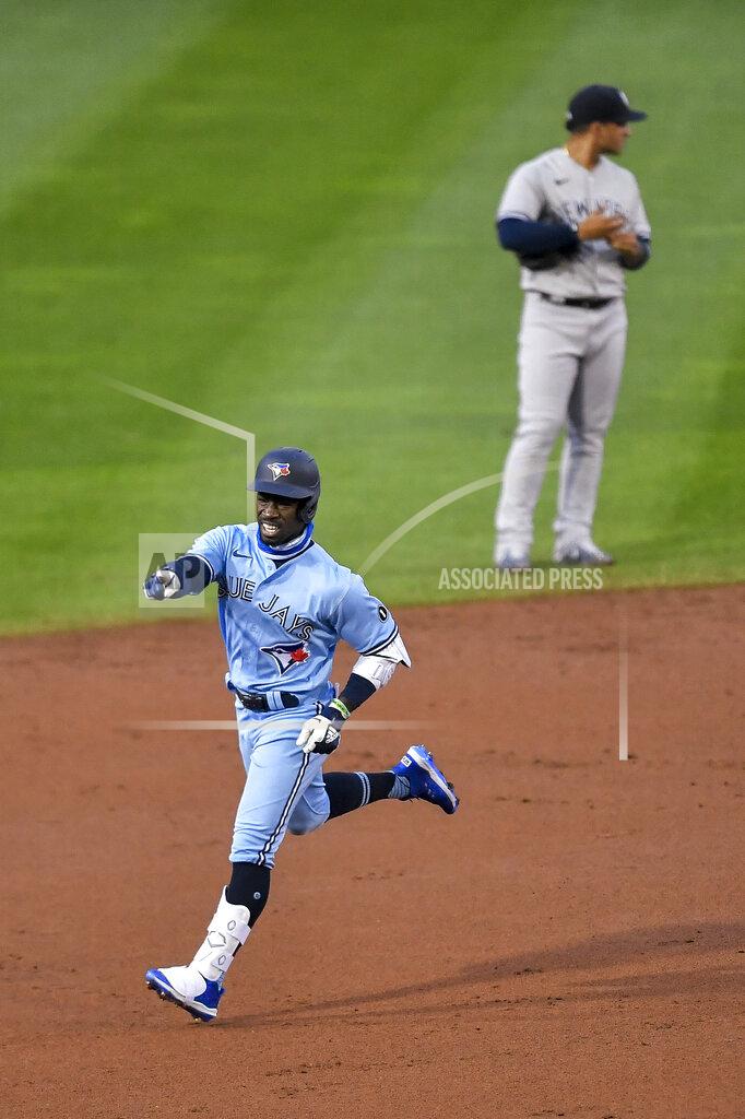 Adrian Kraus Toronto Blue Jays' Jonathan Davis points to the dugout as he runs the bases after hitting a two-run home run against the New York Yankees during the second inning of a baseball game in Buffalo, N.Y., Tuesday, Sept. 8, 2020. (AP Photo/Adrian Kraus)