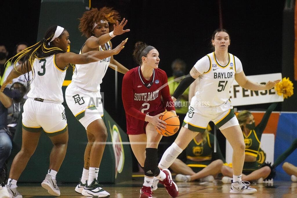 Lm Otero South Dakota guard Liv Korngable (2) looks to pass against Baylor defenders Jordan Lewis (3), NaLyssa Smith (1) and Caitlin Bickle (51) during the first half of a college basketball game in the second round of the NCAA tournament in Waco, Texas, Sunday, March 20, 2022. (AP Photo/LM Otero)