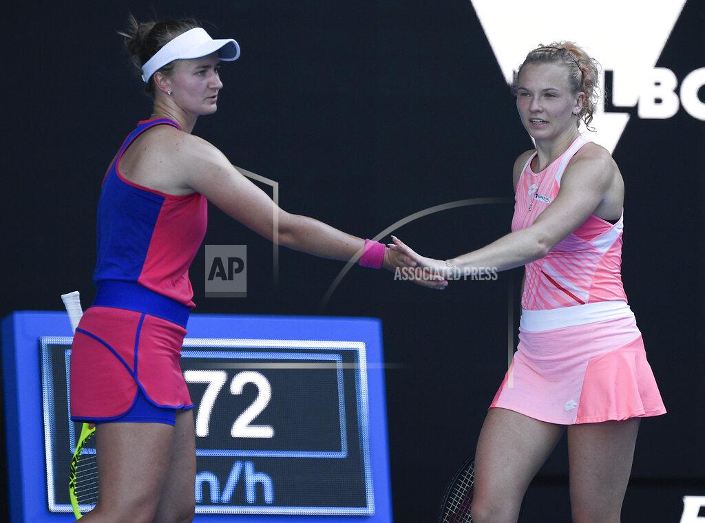 Andy Brownbill Barbora Krejcikova and Katerina Siniakova, right, of the Czech Republic react during their match against Belgium's Elise Mertens and Aryna Sabalenka of Belarus in the women's doubles final at the Australian Open tennis championship in Melbourne, Australia, Friday, Feb. 19, 2021.(AP Photo/Andy Brownbill)