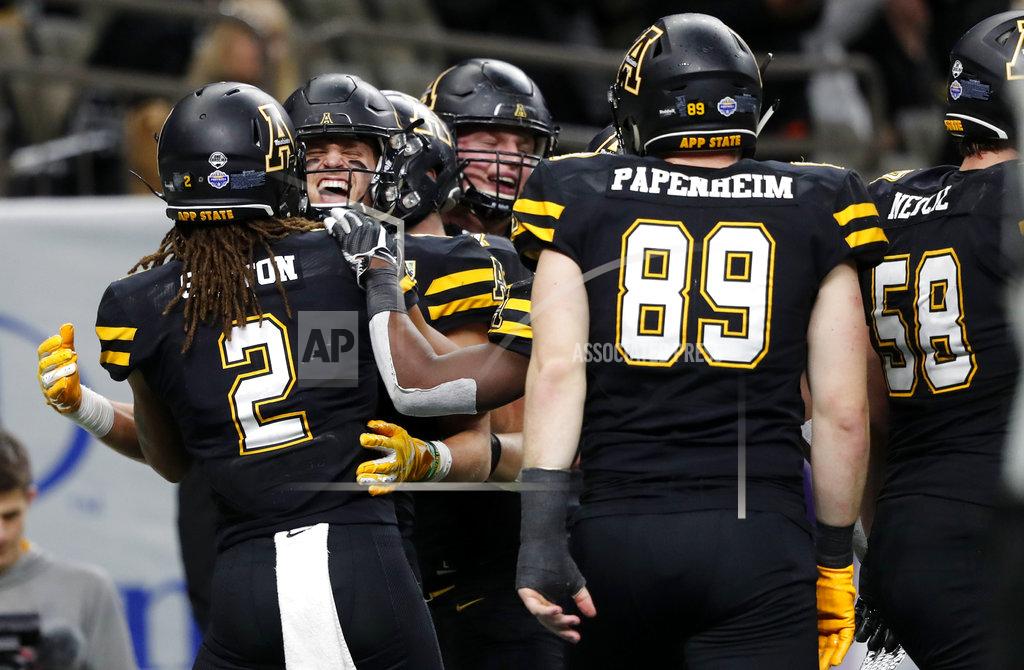 Gerald Herbert Appalachian State wide receiver Corey Xavier Sutton (2) celebrates his touchdown reception with teammates in the second half of the New Orleans Bowl NCAA college football game against Middle Tennessee in New Orleans, Saturday, Dec. 15, 2018. Appalachian State won 45-13. (AP Photo/Gerald Herbert)