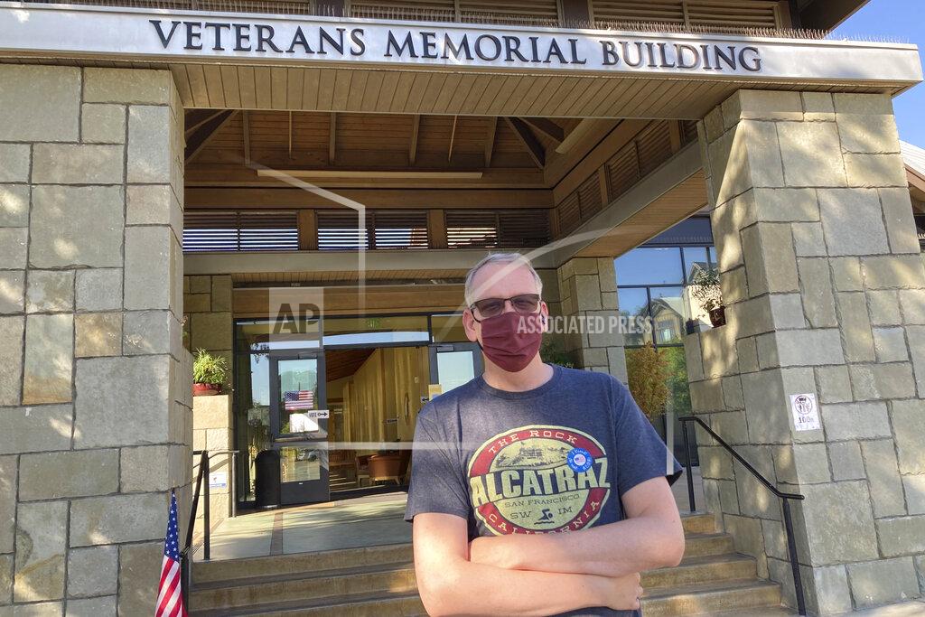 Jocelyn Gecker Erik Peterson, 52, stands outside the Veterans Memorial Building after voting to recall California Gov. Gavin Newsom in Lafayette, Calif., on Tuesday, Sept. 14, 2021. Peterson, who works in construction, is a registered Democrat who says he tends to vote Republican. He voted for Larry Elder because he felt "Newsom's handling of the pandemic was terrible. He told us to shelter in place and stay home and he's out doing fundraisers, unmasked," he said referring to Newsom's now infamous meal at the French Laundry. (AP Photo/Jocelyn Gecker)