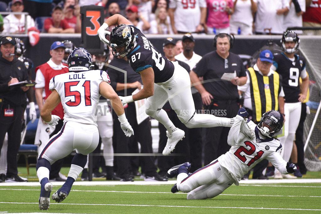 Eric Christian Smith Jacksonville Jaguars tight end Geoff Swaim (87) is tripped up by Houston Texans cornerback Bradley Roby (21) after a catch during the first half of an NFL football game Sunday, Sept. 15, 2019, in Houston. (AP Photo/Eric Christian Smith)