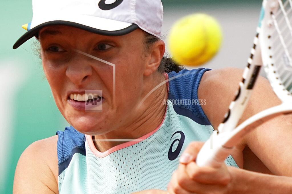 Michel Euler Poland's Iga Swiatek returns the ball to Alison Riske of the U.S. during their second round match of the French Open tennis tournament at the Roland Garros stadium Thursday, May 26, 2022 in Paris. (AP Photo/Michel Euler)