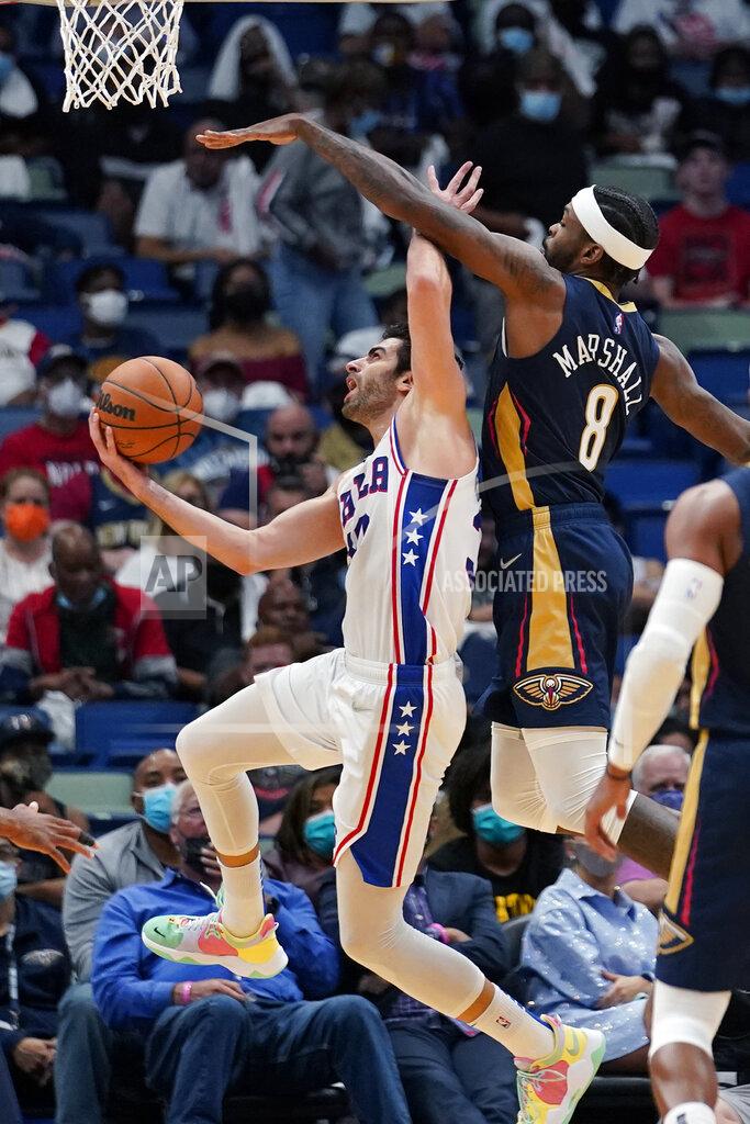 Gerald Herbert Philadelphia 76ers guard Furkan Korkmaz goes to the basket against New Orleans Pelicans forward Naji Marshall (8) in the second half of an NBA basketball game in New Orleans, Wednesday, Oct. 20, 2021. The 76ers won 117-97. (AP Photo/Gerald Herbert)