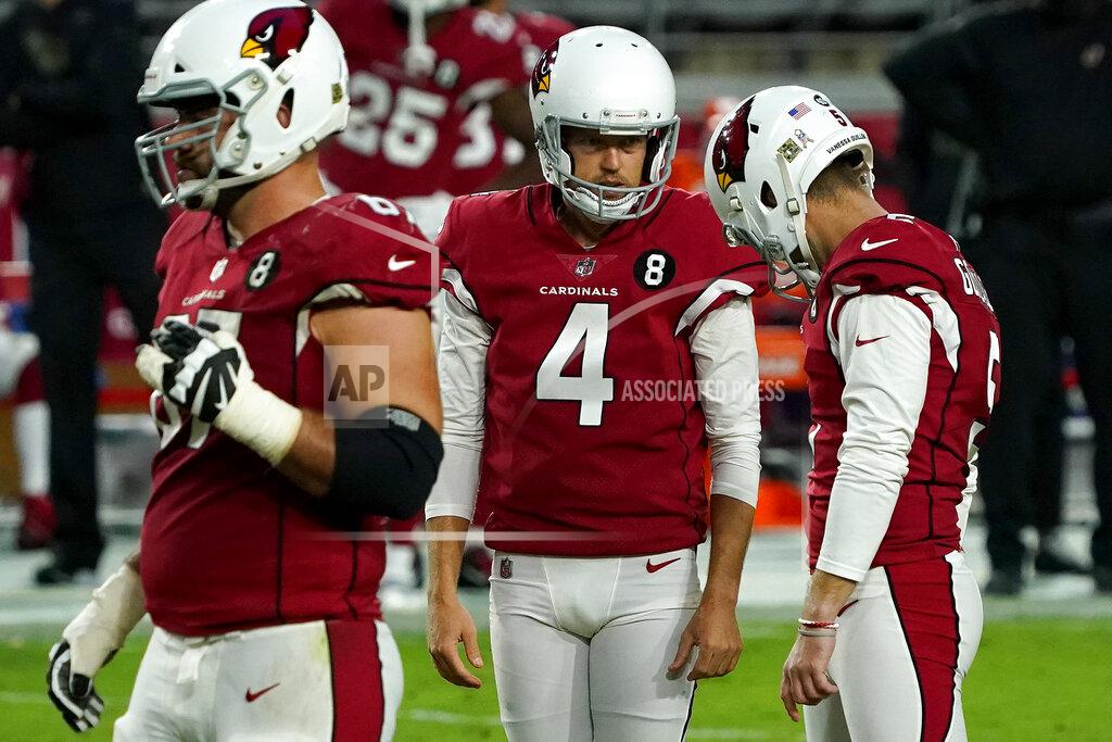 Rick Scuteri Arizona Cardinals punter Andy Lee (4) looks at kicker Zane Gonzalez after Gonzalez missed the game tying field goal attempt during the second half of an NFL football game against the Miami Dolphins, Sunday, Nov. 8, 2020, in Glendale, Ariz. The Dolphins won 34-31. (AP Photo/Rick Scuteri)