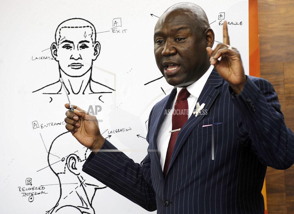 Jay Reeves FILE - In this Monday, Dec. 3, 2018 file photo, attorney Ben Crump holds a news conference in Birmingham, Ala., to discuss the results of a forensic examination on Emantic "EJ" Bradford Jr., who was fatally shot by police in a shopping mall on Thanksgiving day. Crump, who represents Bradford's family, says a report shows the 21-year-old black man suffered three gunshot wounds to the back side of his body. (AP Photo/Jay Reeves)