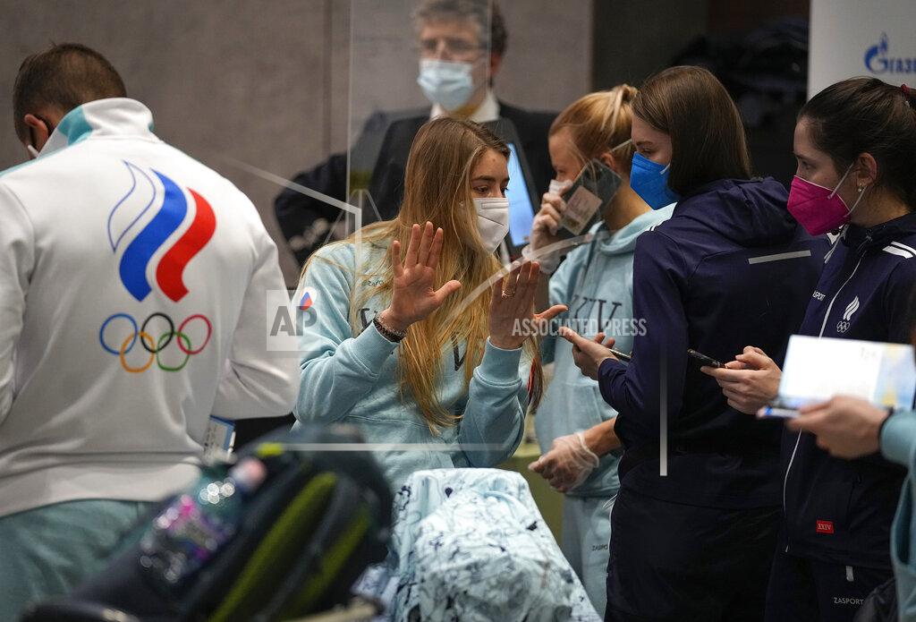 Pavel Golovkin Members of the Russian Olympic Committee team before their departure for the 2022 Winter Beijing Olympic Games in Moscow's Sheremetyevo airport, Russia, Wednesday, Jan. 26, 2022. (AP Photo/Pavel Golovkin)