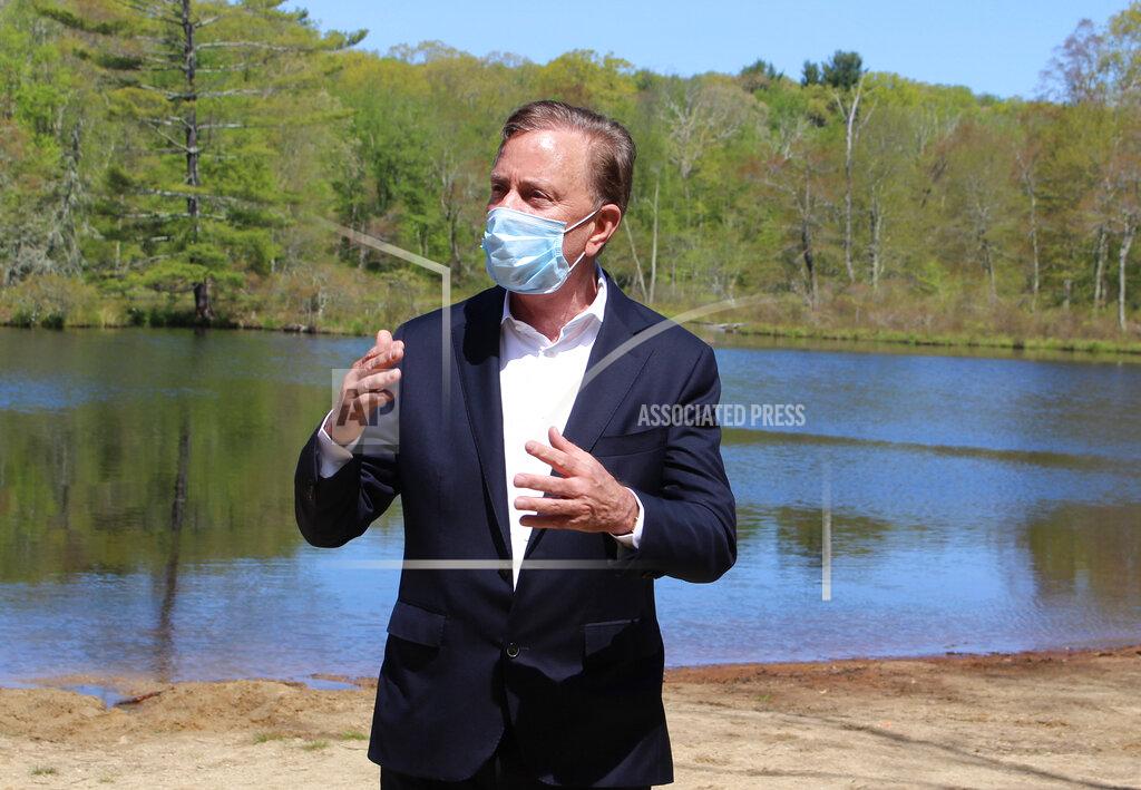 Pat Eaton-Robb FILE - In this May 21, 2020, file photo, Connecticut Gov. Ned Lamont speaks to reporters at Gay City State Park in Hebron, Conn., updating the coronavirus situation in the state. A bipartisan group of Connecticut legislators gave the governor a list of issues to be reviewed in an upcoming, independent third-party investigation into the preparation and response to the coronavirus inside nursing homes and assisted living centers. (AP Photo/Pat Eaton-Robb, File)