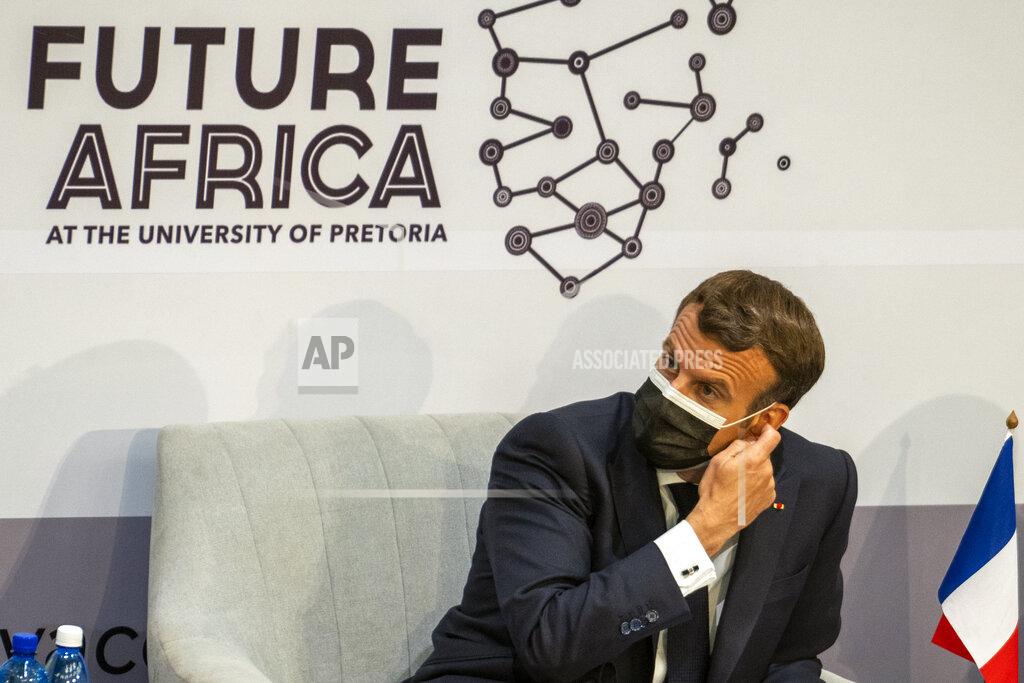 Jerome Delay French President Emmanuel Macron listens to speeches at the University of Pretoria Future Africa in Pretoria, South Africa, Friday May 28, 2021. Macron and South African President Cyril Ramaphosa are launching a program su support African vaccine production, a project backed by the European Union, the United States and the World Bank. (AP Photo/Jerome Delay)