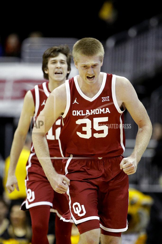Charlie Riedel Oklahoma forward Brady Manek (35) and guard Austin Reaves celebrate after a basket during the first half of an NCAA college basketball game against Missouri, Tuesday, Nov. 26, 2019, in Kansas City, Mo. (AP Photo/Charlie Riedel)