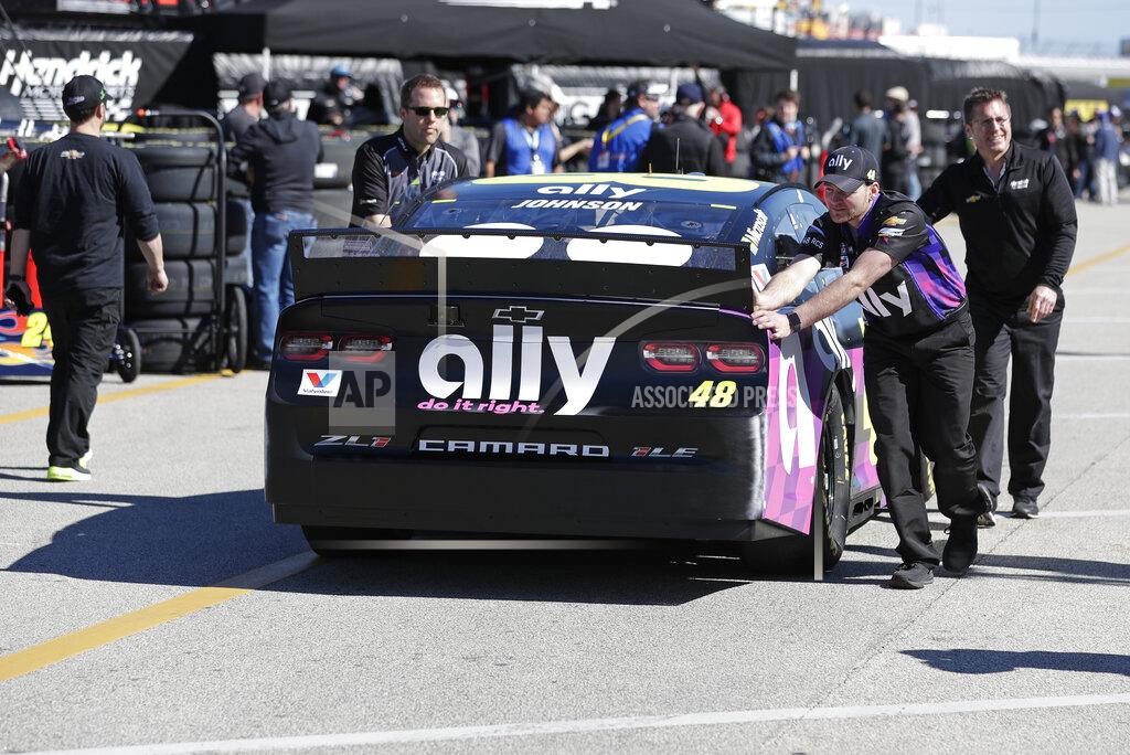 John Raoux Crew members push Jimmie Johnson's car through the garage area during a NASCAR auto race practice at Daytona International Speedway, Saturday, Feb. 8, 2020, in Daytona Beach, Fla. (AP Photo/John Raoux)