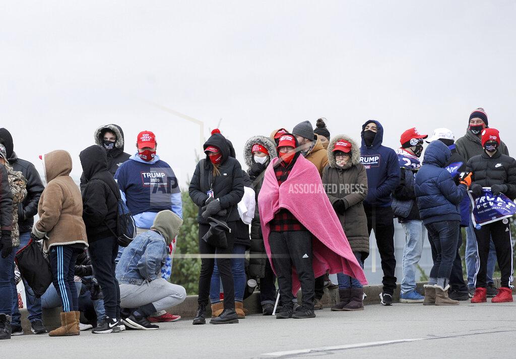 Supporters of President Donald Trump wait in line prior to a campaign rally at the Wilkes Barre/Scranton International Airport, Monday, Nov. 2, 2020, in Wilkes Barre, Pa. (AP Photo/Michael Perez)