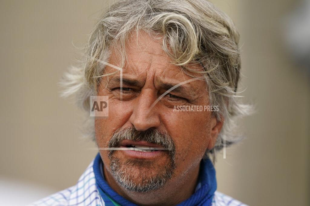 Charlie Riedel Trainer Steve Asmussen talks to the media after workouts at Churchill Downs Wednesday, April 28, 2021, in Louisville, Ky. Asmussen has two horses, Midnight Bourbon and Super Stock, entered in the 147th running of the Kentucky Derby on Saturday, May 1. (AP Photo/Charlie Riedel)