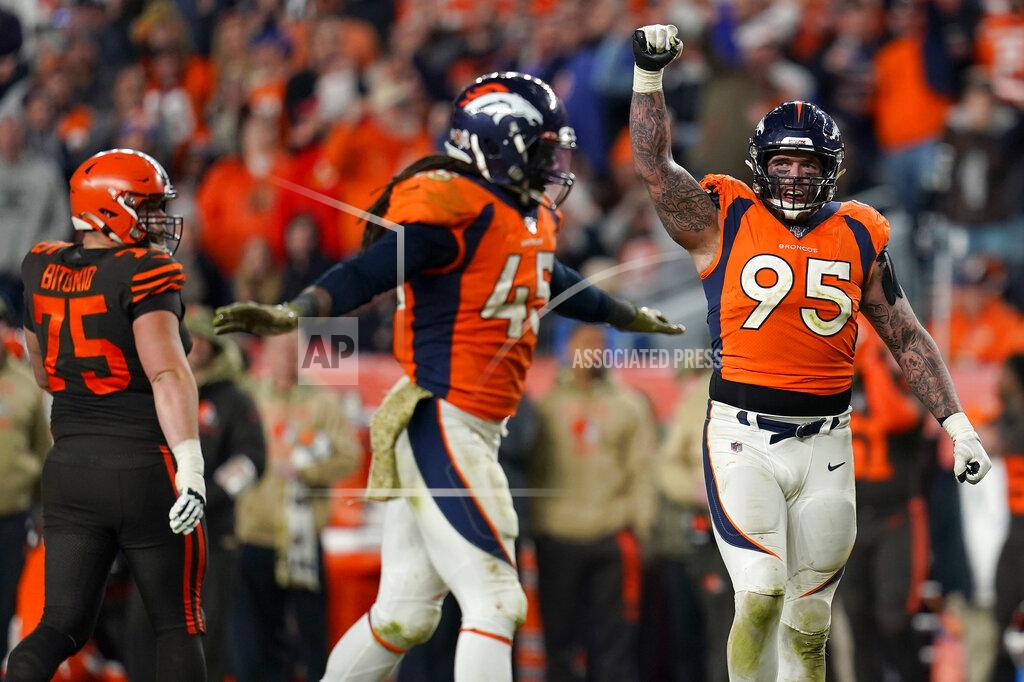 Jack Dempsey Denver Broncos defensive end Derek Wolfe (95) and linebacker A.J. Johnson (45) celebrate a defensive stop during the second half of an NFL football game against the Cleveland Browns, Sunday, Nov. 3, 2019, in Denver. The Broncos won 24-19. (AP Photo/Jack Dempsey)