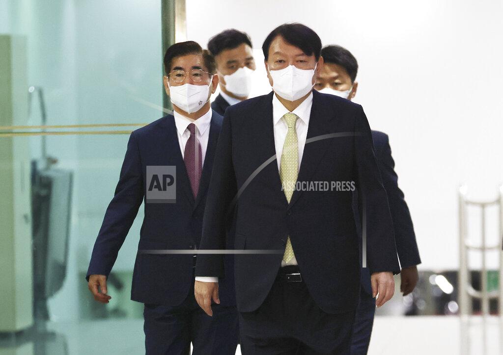 Ahn Jung-Won South Korean President Yoon Suk Yeol, front, arrives to attend the National Security Council (NSC) meeting at the presidential office in Seoul, South Korea, Wednesday, May 25, 2022. North Korea launched ballistic missiles toward the sea on Wednesday, its neighbors said, hours after President Joe Biden wrapped up his trip to Asia where he reaffirmed U.S. commitment to defend its allies in the face of the North's growing nuclear threat. (Ahn Jung-won/Yonhap via AP)