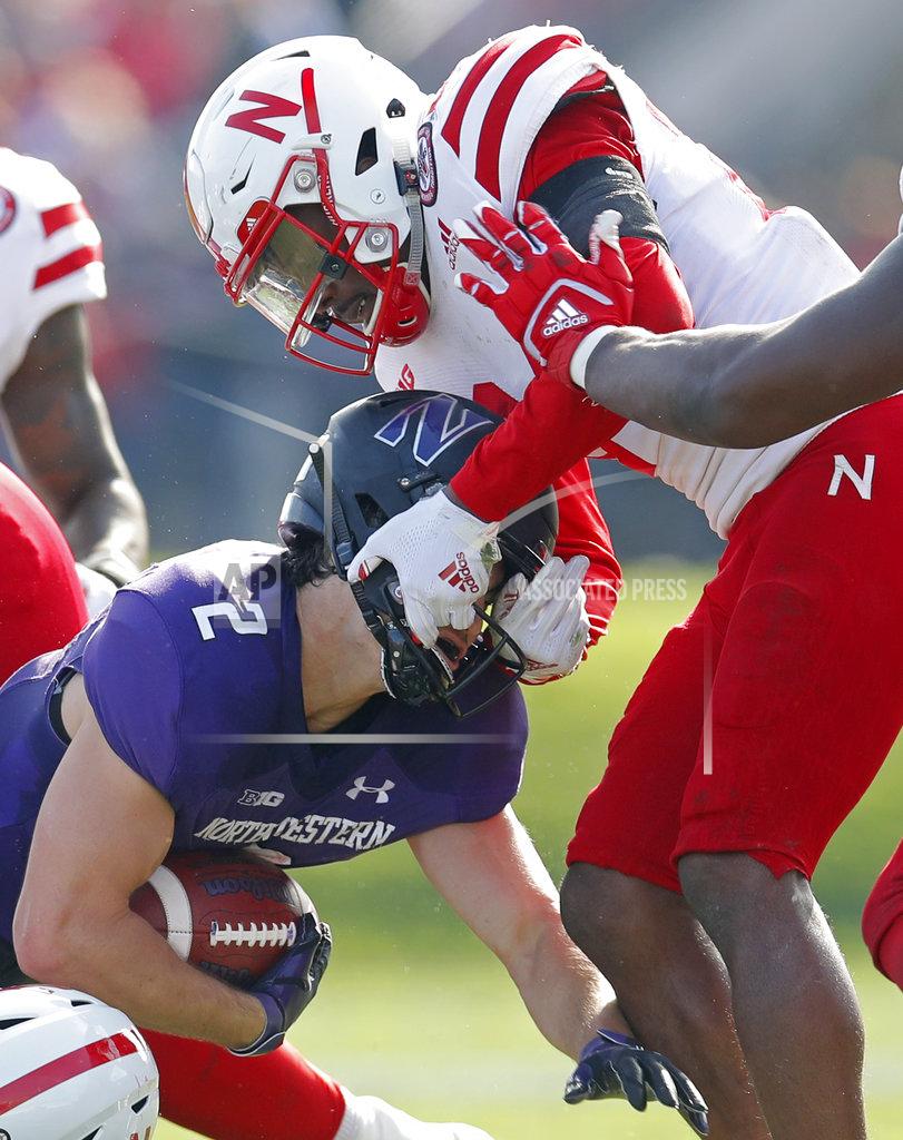 Jim Young Northwestern's Flynn Nagel, left, is tackled by Nebraska's Aaron Williams during the second half of an NCAA college football game Saturday, Oct. 13, 2018, in Evanston, Ill. (AP Photo/Jim Young)