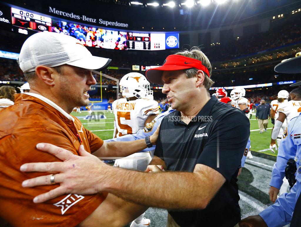 Butch Dill Texas coach Tom Herman, left, greets Georgia coach Kirby Smart after the Sugar Bowl NCAA college football game in New Orleans, Tuesday, Jan. 1, 2019. Texas won 28-21. (AP Photo/Butch Dill)