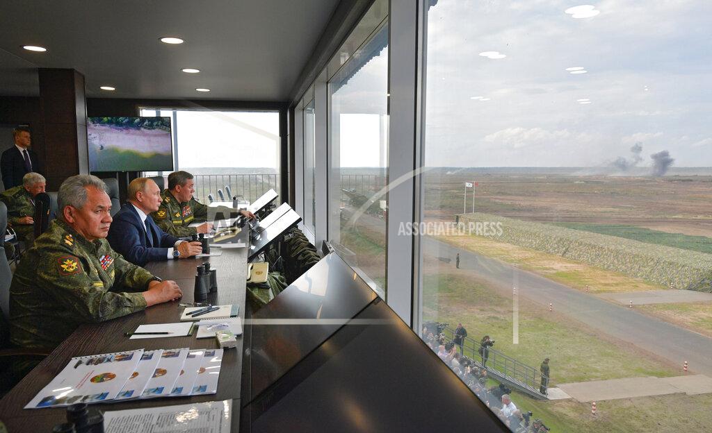 Alexei Druzhinin Russian President Vladimir Putin, center, Russian Defense Minister Sergei Shoigu, left, and Russian General Staff Valery Gerasimov, right, watch the joint strategic exercise of the armed forces of the Russian Federation and the Republic of Belarus Zapad-2021 at the Mulino training ground in the Nizhny Novgorod region, Russia, Monday, Sept. 13, 2021. The military drills attend by servicemen of military units and divisions of the Western Military District, representatives of the leadership headquarters and personnel of military contingents of the armed forces of Armenia, Belarus, India, Kazakhstan, Kyrgyzstan and Mongolia. (Alexei Druzhinin, Sputnik, Kremlin Pool Photo via AP)