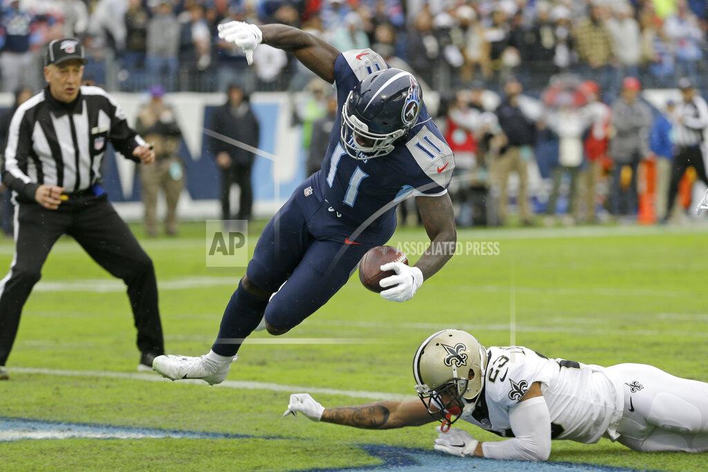 James Kenney Tennessee Titans wide receiver A.J. Brown (11) gets into the end zone past New Orleans Saints cornerback Marshon Lattimore (23) as Brown scores a touchdown on a 49-yard run in the first half of an NFL football game Sunday, Dec. 22, 2019, in Nashville, Tenn. (AP Photo/James Kenney)