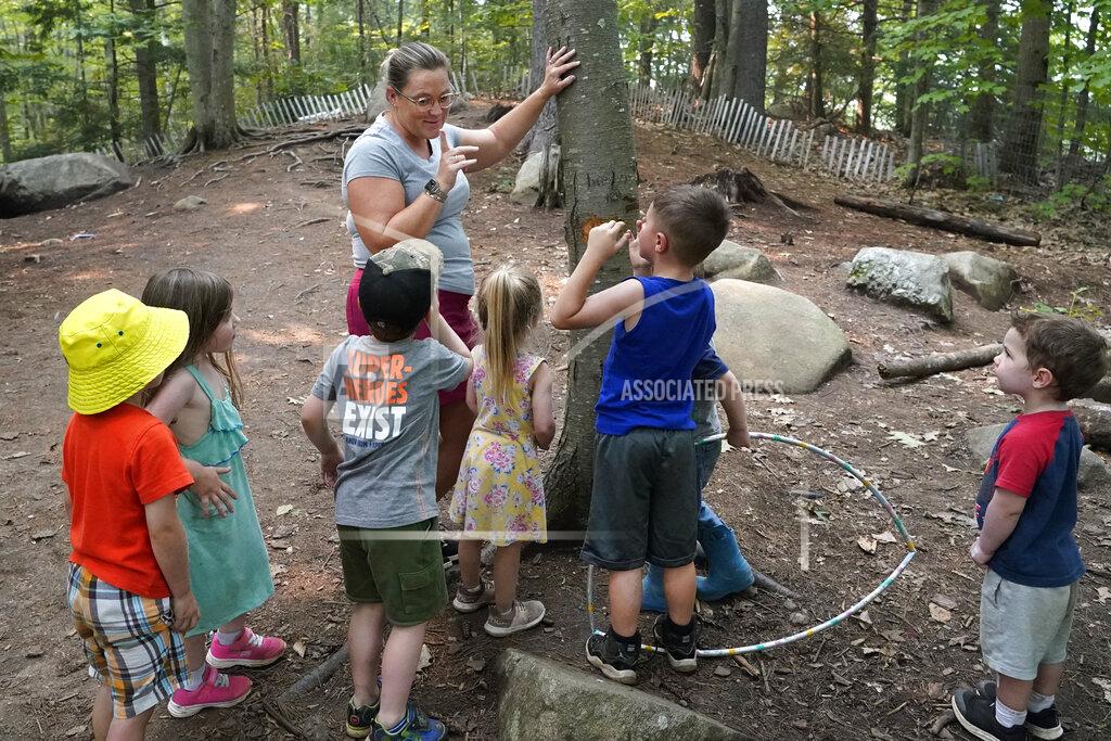 Elise Amendola In this July 26, 2021 photo, Jennifer Briggs-Legere teaches a nature lesson to children at her A Place To Grow daycare center in Brentwood, N.H. Families are starting to spend the money from the expanded child tax credit, part of President Joe Biden's $1.9 trillion coronavirus relief package. Many say they are using the money to pay rent, supplement their grocery budgets and for catching up on bills, including cellphone and car payments. Biden increased the amounts going to families and has expanded it to include those whose income is so little they don't owe taxes. (AP Photo/Elise Amendola)