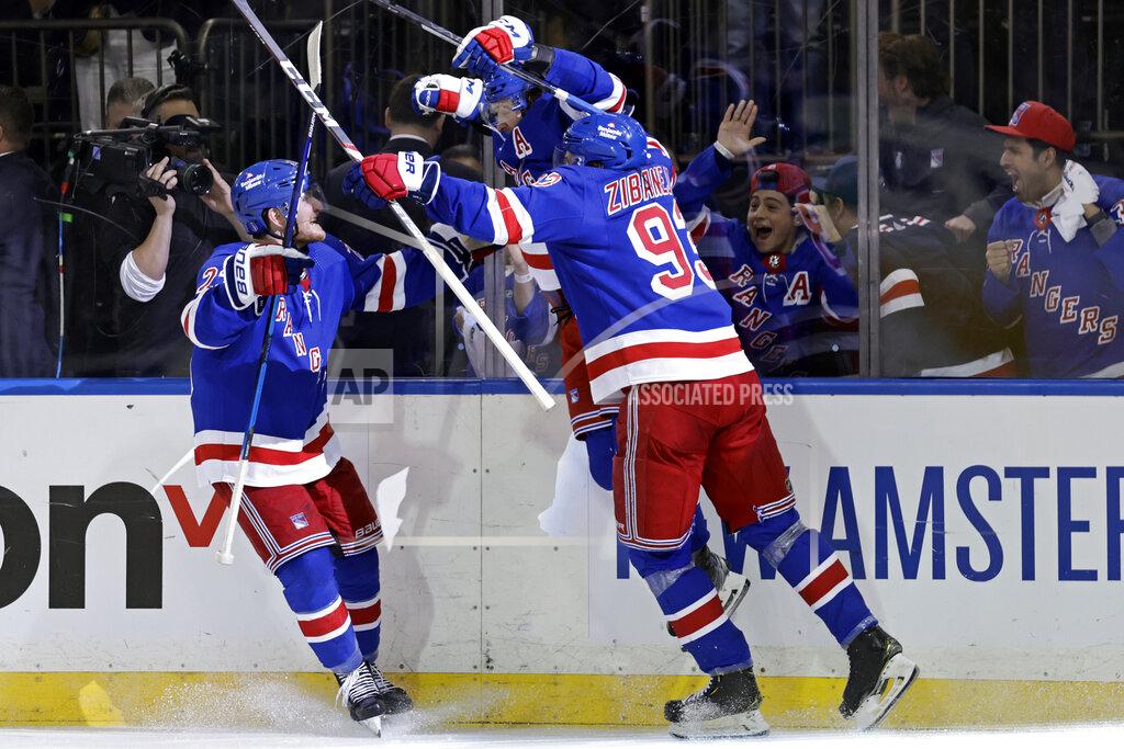 Adam Hunger New York Rangers left wing Artemi Panarin (10) reacts with teammates after scoring the game winning goal against the Pittsburgh Penguins during overtime in Game 7 of an NHL hockey Stanley Cup first-round playoff series Sunday, May 15, 2022, in New York. The Rangers won 4-3 in overtime. (AP Photo/Adam Hunger)