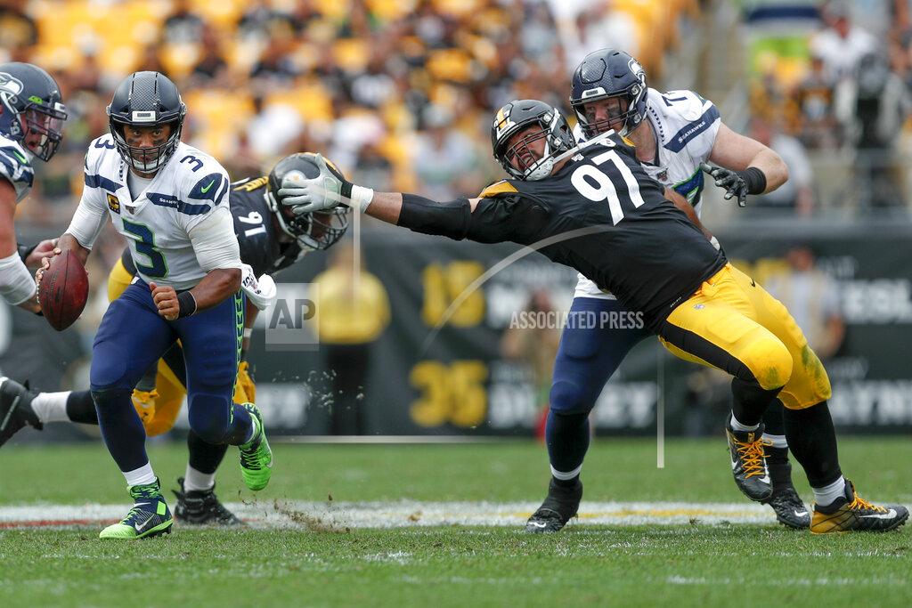 Don Wright Seattle Seahawks quarterback Russell Wilson (3) scrambles away from Pittsburgh Steelers defensive end Cameron Heyward (97) on his way to a first down in the second half of an NFL football game, Sunday, Sept. 15, 2019, in Pittsburgh. (AP Photo/Don Wright)
