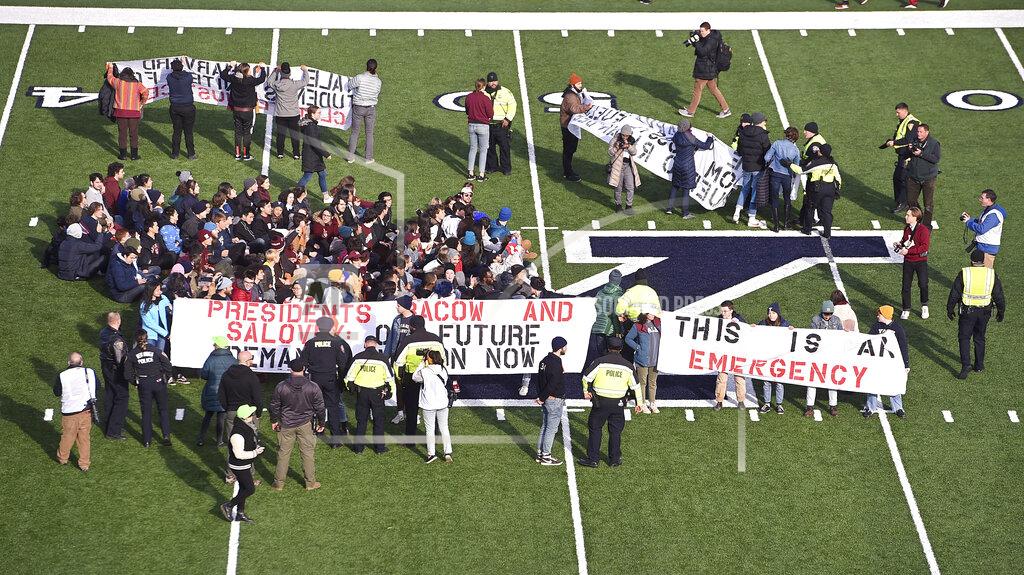 Arnold Gold Demonstrators stage a climate change protest at the Yale Bowl delaying the start of the second half of an NCAA college football game between Harvard and Yale Saturday, Nov. 23, 2019, in in New Haven, Conn. (Arnold Gold/New Haven Register via AP)