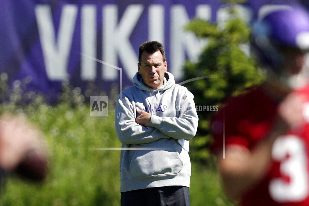 FILE - In this June 13, 2019, file photo, Minnesota Vikings assistant head coach and offensive advisor Gary Kubiak watches quarterbacks during drills at the team's NFL football training facility in Eagan, Minn. The Vikings have chosen Kubiak as their offensive coordinator. He fills the vacancy created by Kevin Stefanski's departure to become head coach of the Cleveland Browns. The widely expected move was confirmed by a person with knowledge of the decision. The person spoke to The Associated Press on condition of anonymity because the club had not yet made the announcement. The 58-year-old Kubiak served as offensive adviser and assistant to head coach Mike Zimmer this season. (AP Photo/Andy Clayton- King, File)