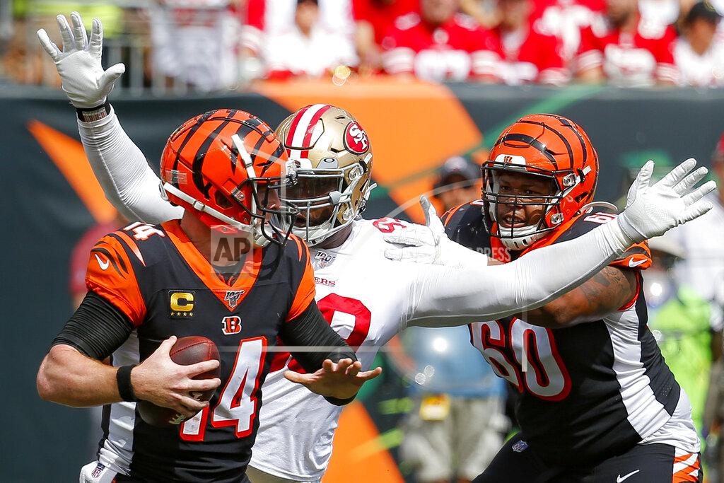 Frank Victores Cincinnati Bengals quarterback Andy Dalton (14) is sacked by San Francisco 49ers defensive tackle DeForest Buckner, center, during the second half an NFL football game, Sunday, Sept. 15, 2019, in Cincinnati. (AP Photo/Frank Victores)